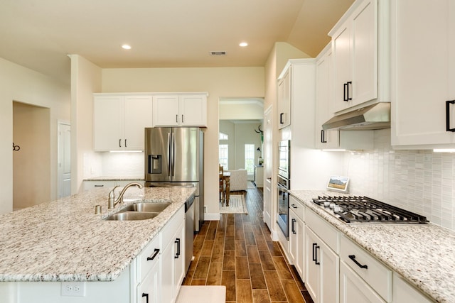 kitchen with white cabinets, dark hardwood / wood-style floors, stainless steel appliances, and sink