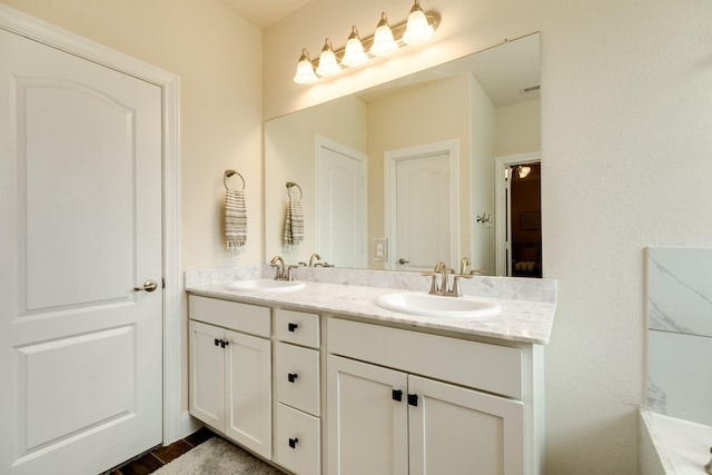 bathroom featuring vanity and hardwood / wood-style flooring