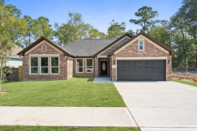 view of front facade with a front yard and a garage