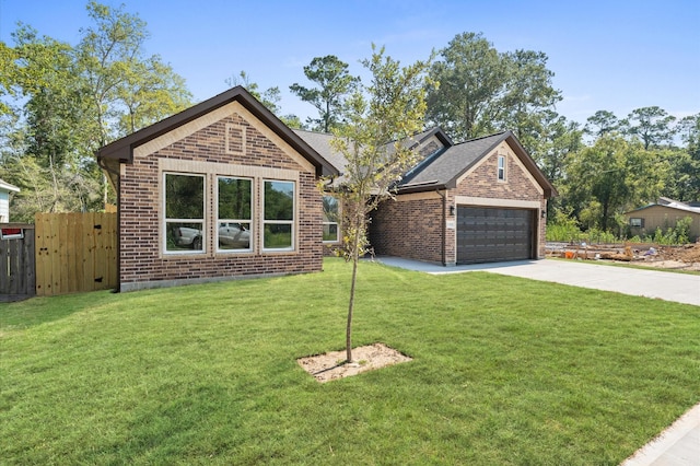 view of front of house with a garage and a front lawn