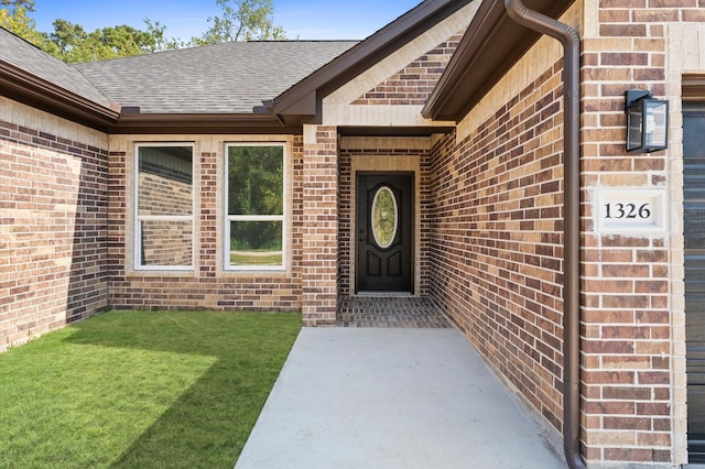 property entrance with a yard