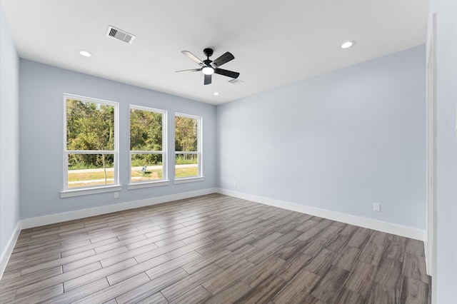 empty room with light wood-type flooring and ceiling fan