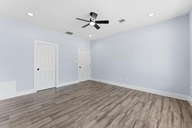 spare room featuring light hardwood / wood-style flooring and ceiling fan