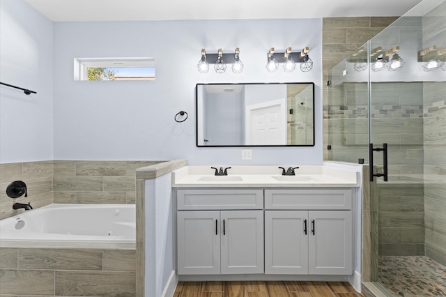 bathroom with hardwood / wood-style floors, vanity, and plus walk in shower