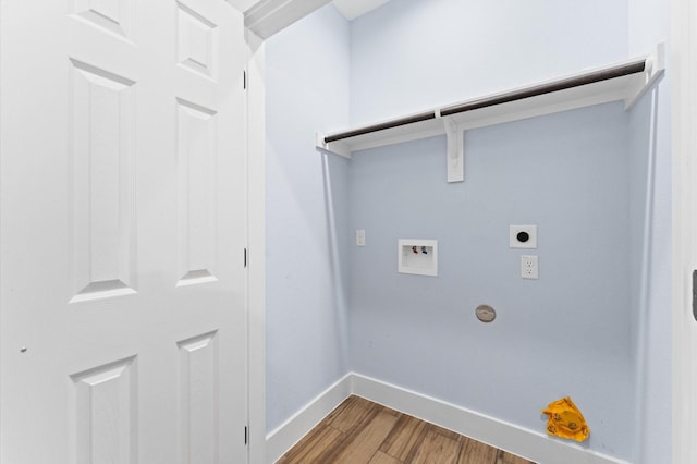 clothes washing area with hardwood / wood-style flooring, hookup for an electric dryer, and hookup for a washing machine