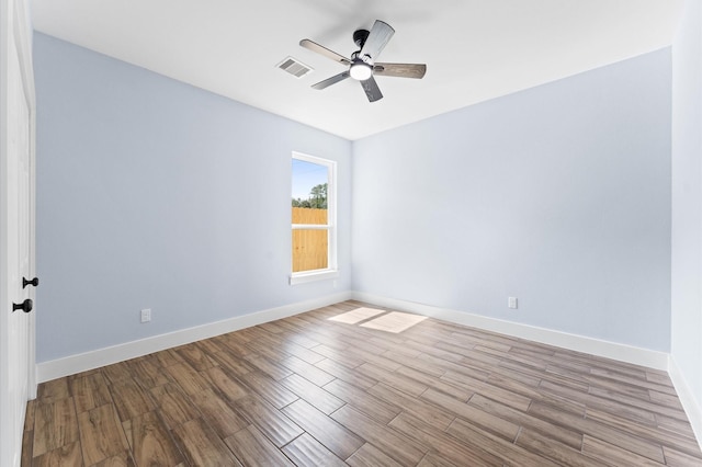 spare room featuring light wood-type flooring and ceiling fan