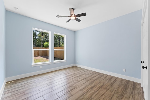 unfurnished room featuring light hardwood / wood-style floors and ceiling fan