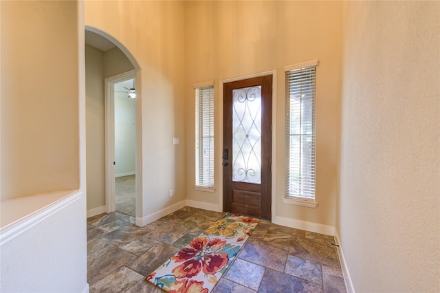 entrance foyer featuring ceiling fan