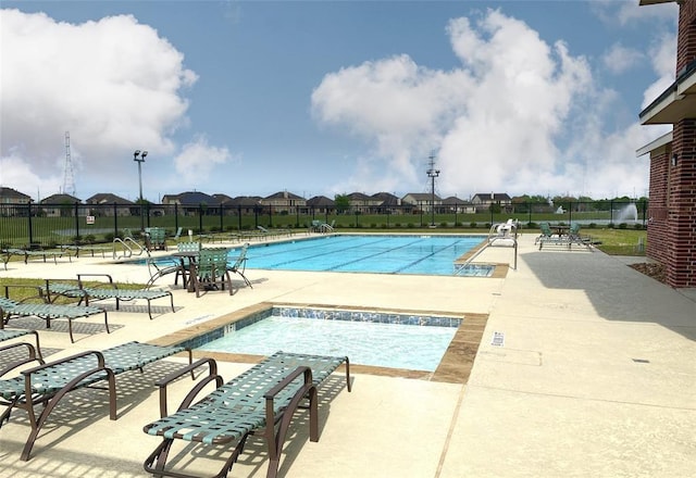 view of pool featuring a patio area