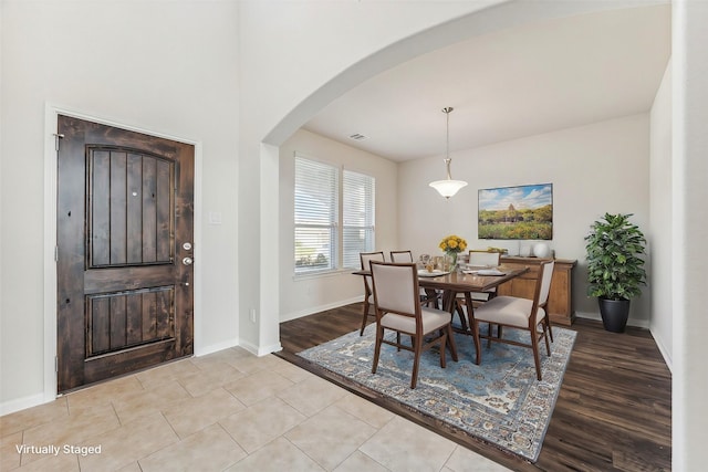 dining room with light tile patterned flooring