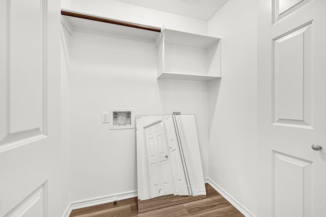 washroom featuring hookup for a washing machine and dark hardwood / wood-style floors