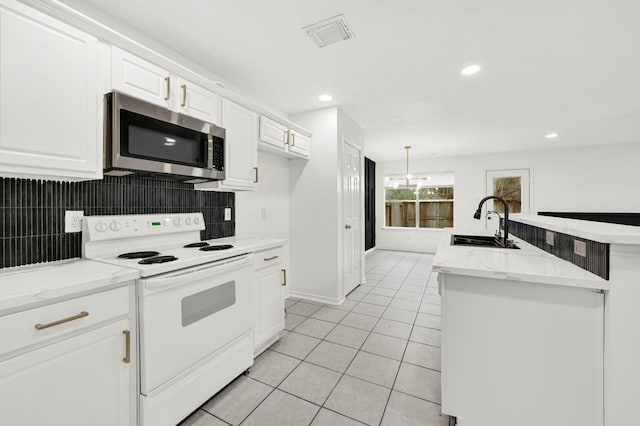 kitchen with white cabinetry, electric range, sink, backsplash, and light tile patterned floors