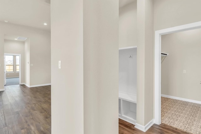 corridor featuring dark hardwood / wood-style floors