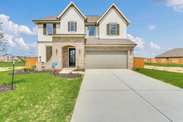 view of front facade with a front yard and a garage