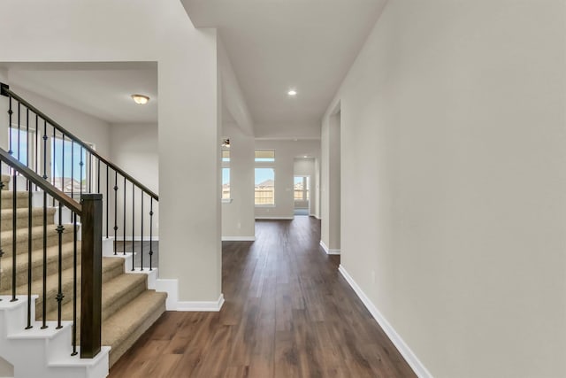 hallway with dark hardwood / wood-style floors