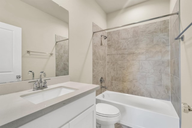 full bathroom with vanity, toilet, and tiled shower / bath