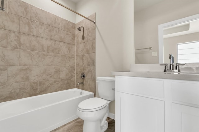 full bathroom featuring tile patterned floors, vanity, toilet, and tiled shower / bath