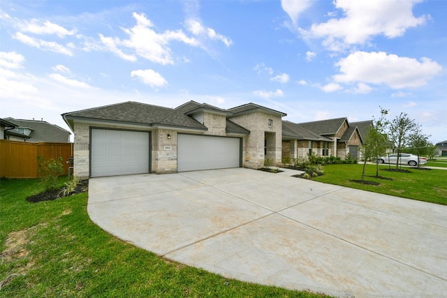 view of front of house with a front yard and a garage