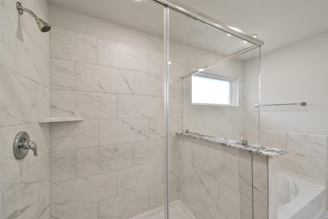 bathroom with shower with separate bathtub