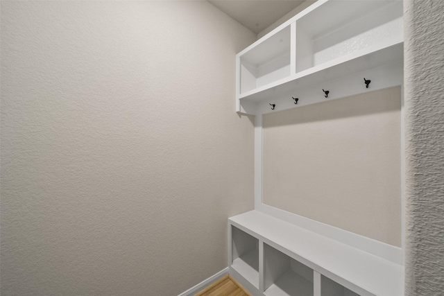 mudroom with hardwood / wood-style floors