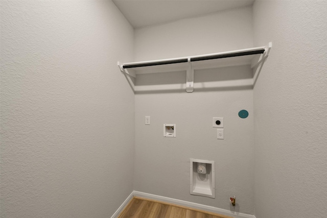 laundry room with hookup for an electric dryer, washer hookup, gas dryer hookup, and hardwood / wood-style floors