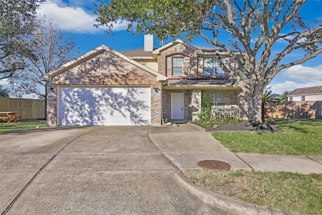 view of front of home with a garage and a front yard