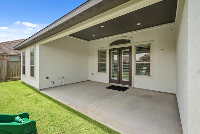 entrance to property featuring a patio