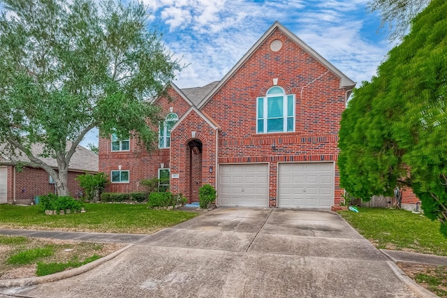 view of front of home with a garage and a front lawn