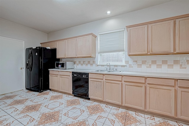 kitchen with tasteful backsplash, light brown cabinetry, sink, and black appliances