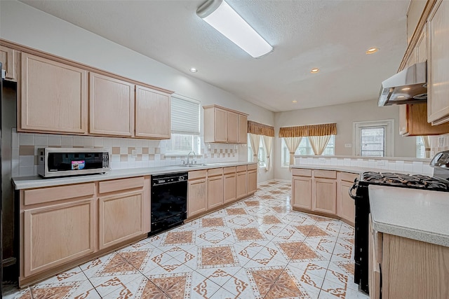 kitchen featuring decorative backsplash, light brown cabinets, black appliances, and range hood