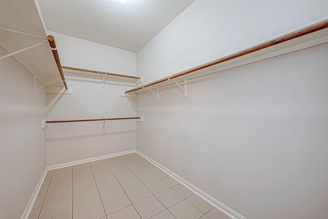 walk in closet featuring light tile patterned floors