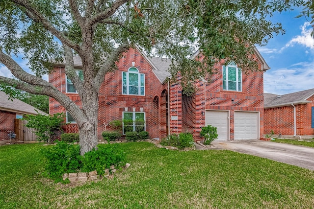 view of front of home with a garage and a front lawn