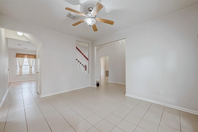 unfurnished room featuring ceiling fan and light tile patterned flooring