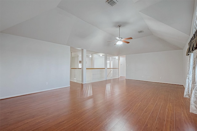 unfurnished living room with ceiling fan, wood-type flooring, and lofted ceiling