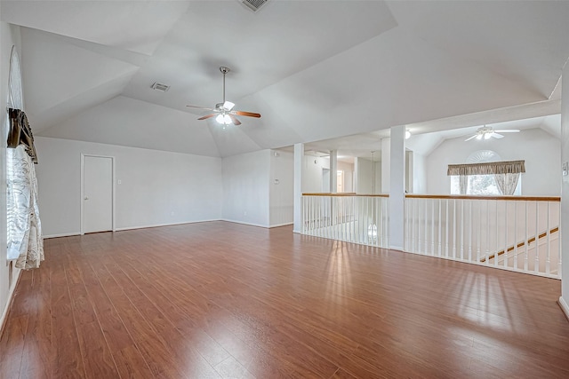 unfurnished room with lofted ceiling, ceiling fan, and wood-type flooring