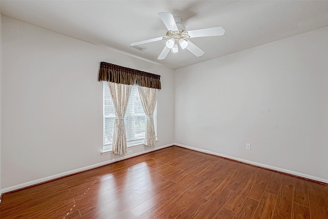 unfurnished room featuring hardwood / wood-style floors and ceiling fan