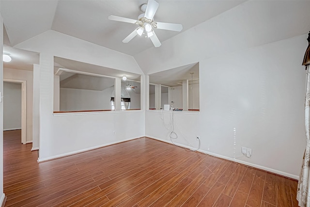 unfurnished room featuring ceiling fan, vaulted ceiling, and hardwood / wood-style flooring