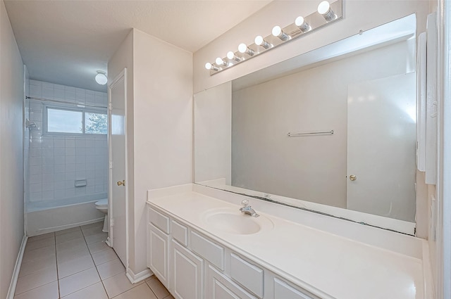 full bathroom with tile patterned floors, vanity, toilet, and tiled shower / bath combo