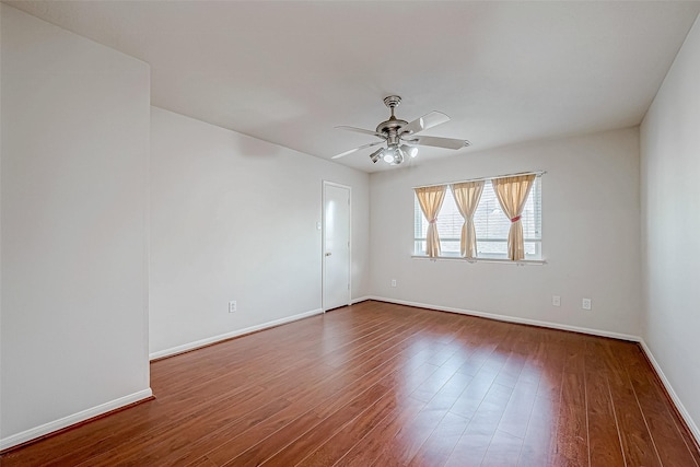 empty room featuring ceiling fan and wood-type flooring