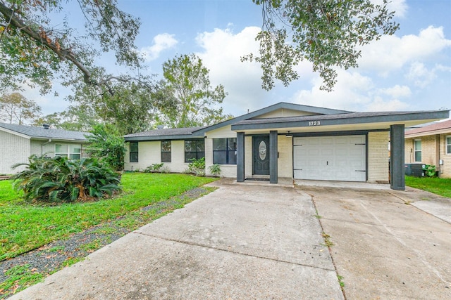 ranch-style home with a front yard and a garage