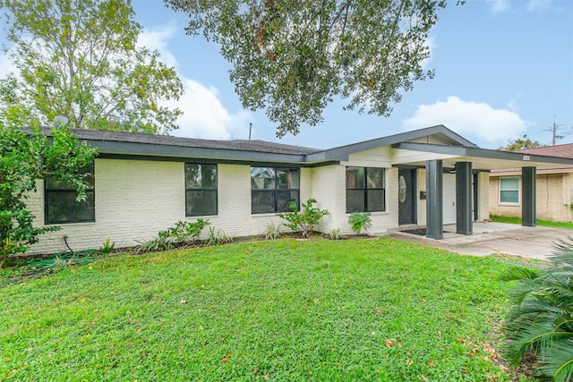 single story home with a patio and a front lawn