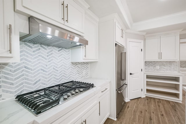 kitchen with white cabinetry, light hardwood / wood-style flooring, and stainless steel appliances