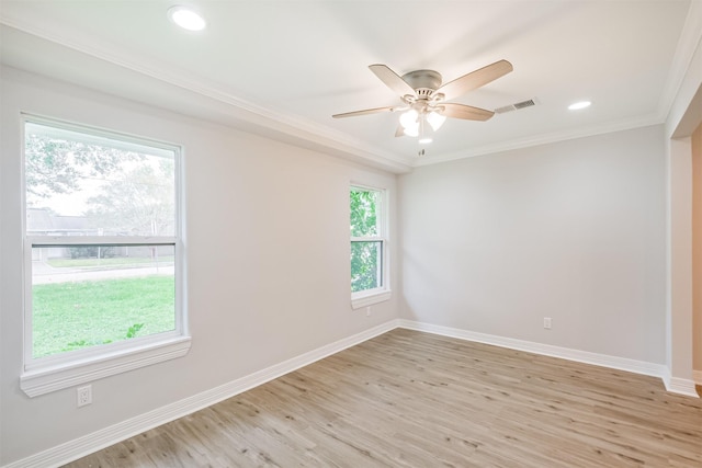 unfurnished room with light hardwood / wood-style floors, ceiling fan, and crown molding