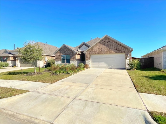 view of front of property with a front lawn and a garage