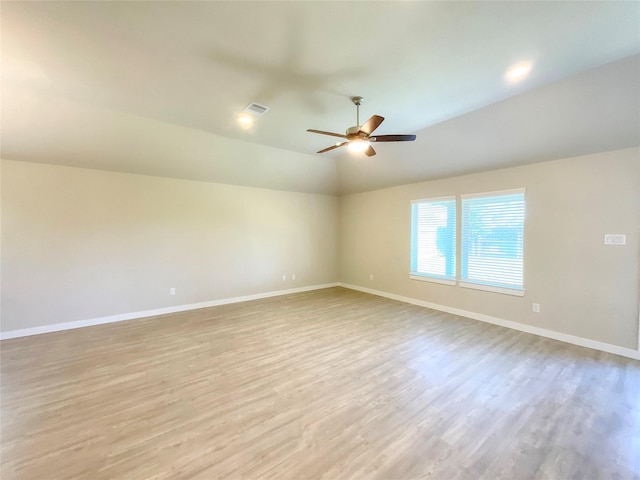 unfurnished room with light wood-type flooring, ceiling fan, and lofted ceiling