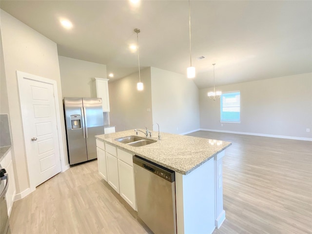 kitchen with white cabinetry, a kitchen island with sink, and appliances with stainless steel finishes