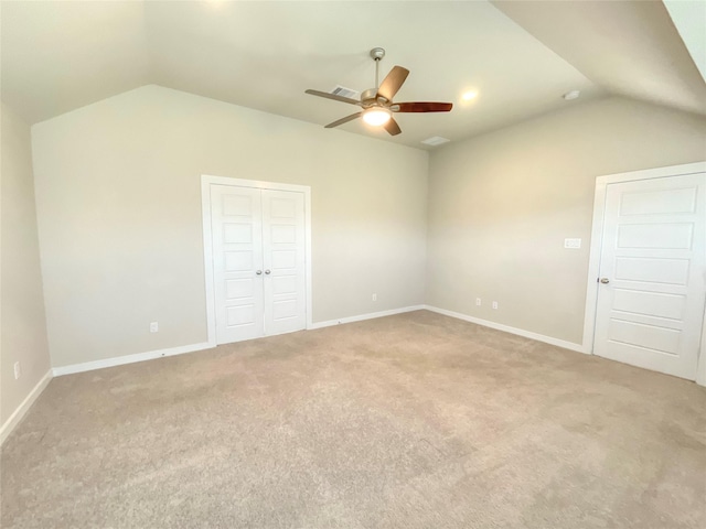 interior space featuring ceiling fan and vaulted ceiling