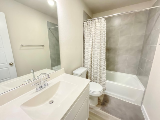 full bathroom with vanity, wood-type flooring, shower / tub combo, and toilet