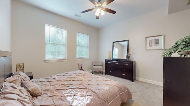 bedroom featuring ceiling fan and light colored carpet