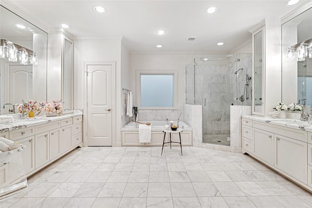 bathroom with vanity, crown molding, and independent shower and bath